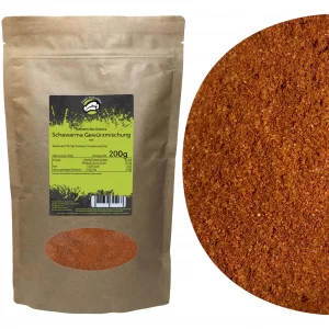Schawarma Gewürzmischung in nachhaltiger brauner Papiertüte mit grünem Etikett. Zutaten: Paprika rot, Chili, Salz, Knoblauch, Kreuzkümmel, Zimt. Nährwerte pro 100g: 204kcal, Fett 4.5g, Kohlenhydrate 23.0g (davon Zucker 7.0g), Eiweiß 7.2g, Salz 27.0g. Neben der Verpackung liegt eine Nahaufnahme der würzigen Shawarma-Gewürzmischung mit intensiver Farbe und feiner Textur.